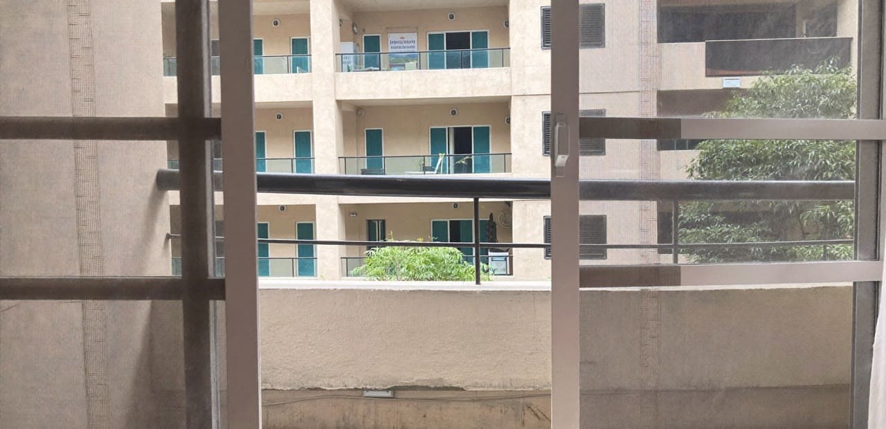Apartment balcony with planter boxes and sliding glass door